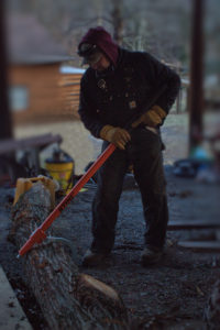 Chuck using a cant hook to move a log at bren chucks wood sawmill at pioneer mountain homestead in south central pa