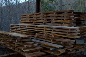 Stacks of cherry boards sawed at Bren Chucks Wood, a division of Pioneer Mountain Homestead