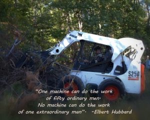 Chuck running the Bobcat skid steer with our quote of the day