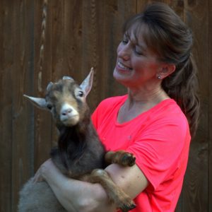 Bee and her Nigerian Dwarf buck named Rudy.