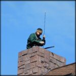 Chuck is cleaning the chimney at the homestead.