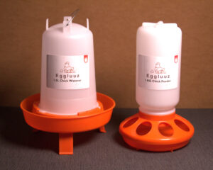 Chicken waterer and feeder with the legs in the medium height position.